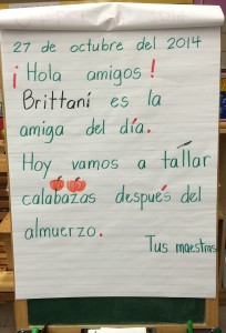 A morning message in Spanish using green for Spanish text. I also try to consistently color code other things to help students notice them (here, names in Black and punctuation in red).