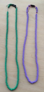 Beaded necklaces that I wear when speaking each language. I also use scarves.